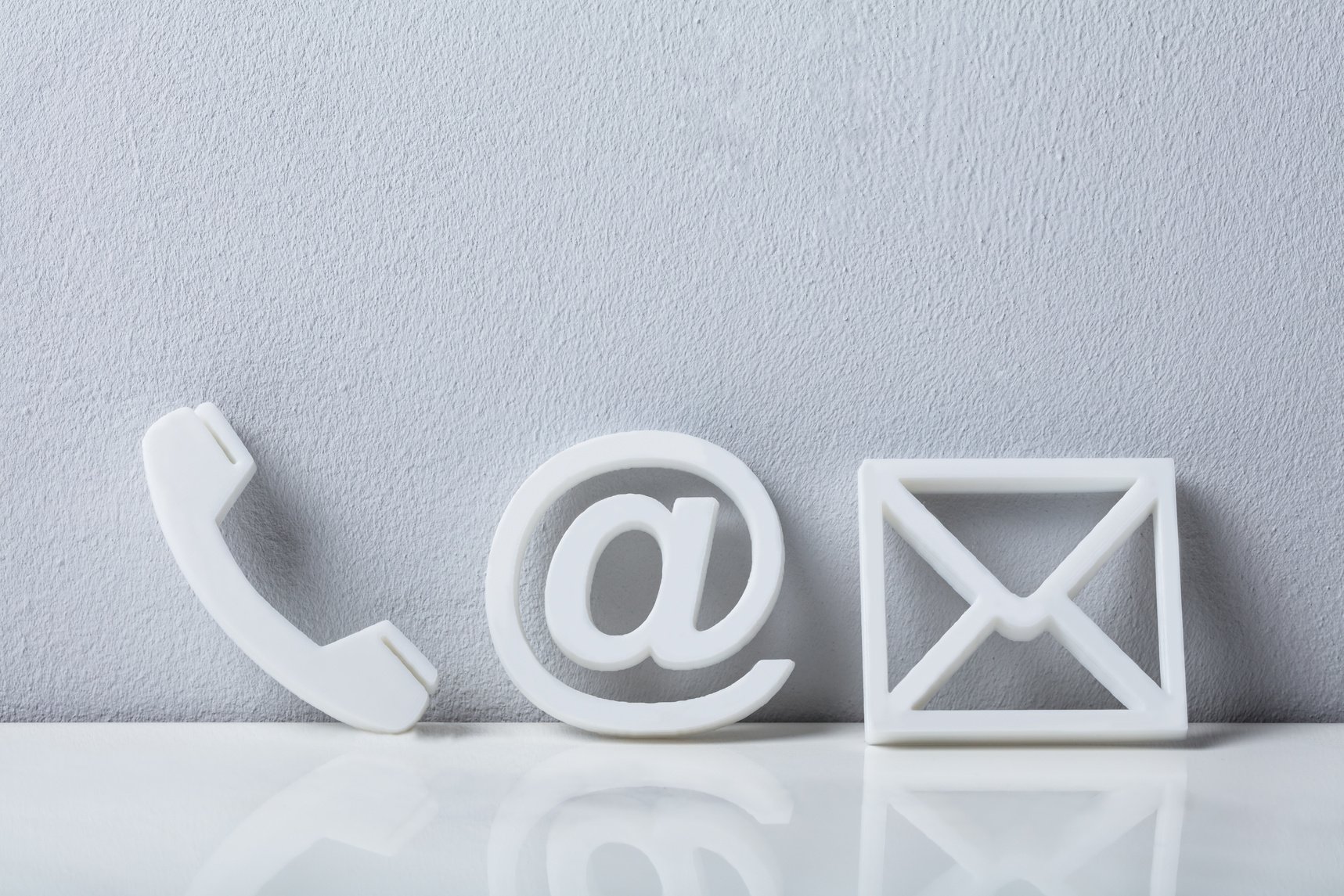 Close-up Of A Phone, Email and Post Icons